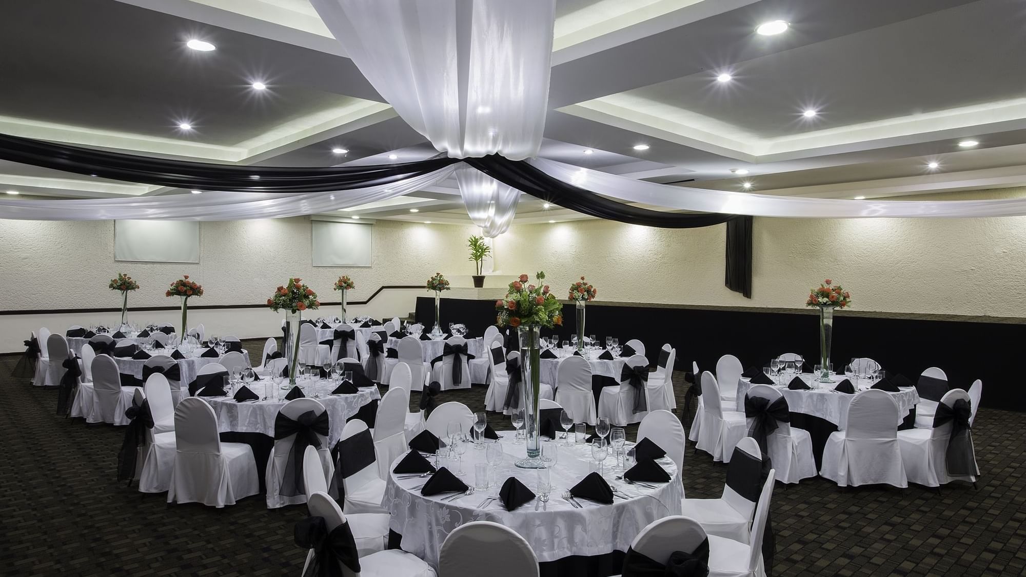 Spacious Meeting Room with banquet tables arranged at Gamma Pachuca