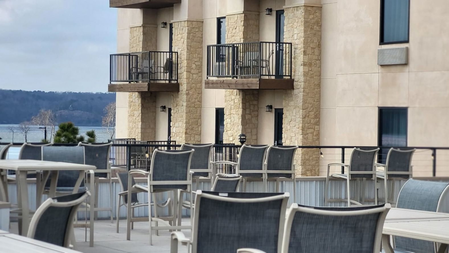 Balconies of a modern building overlook Rooftop Patio at Shangri-La Monkey Island