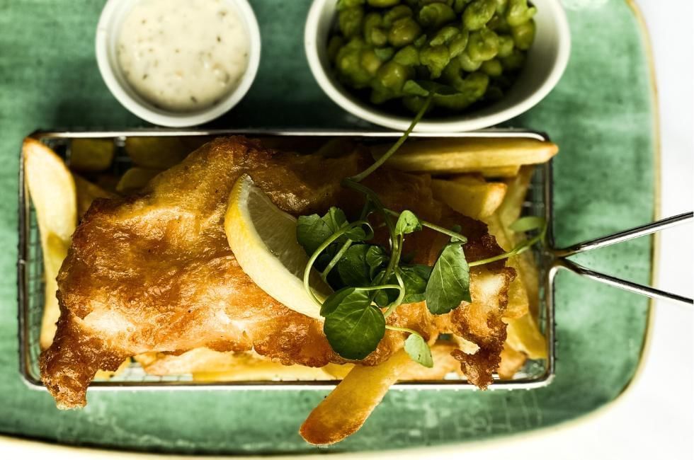 fish and chips with mushy peas and tartare sauce at gorse hill, surrey