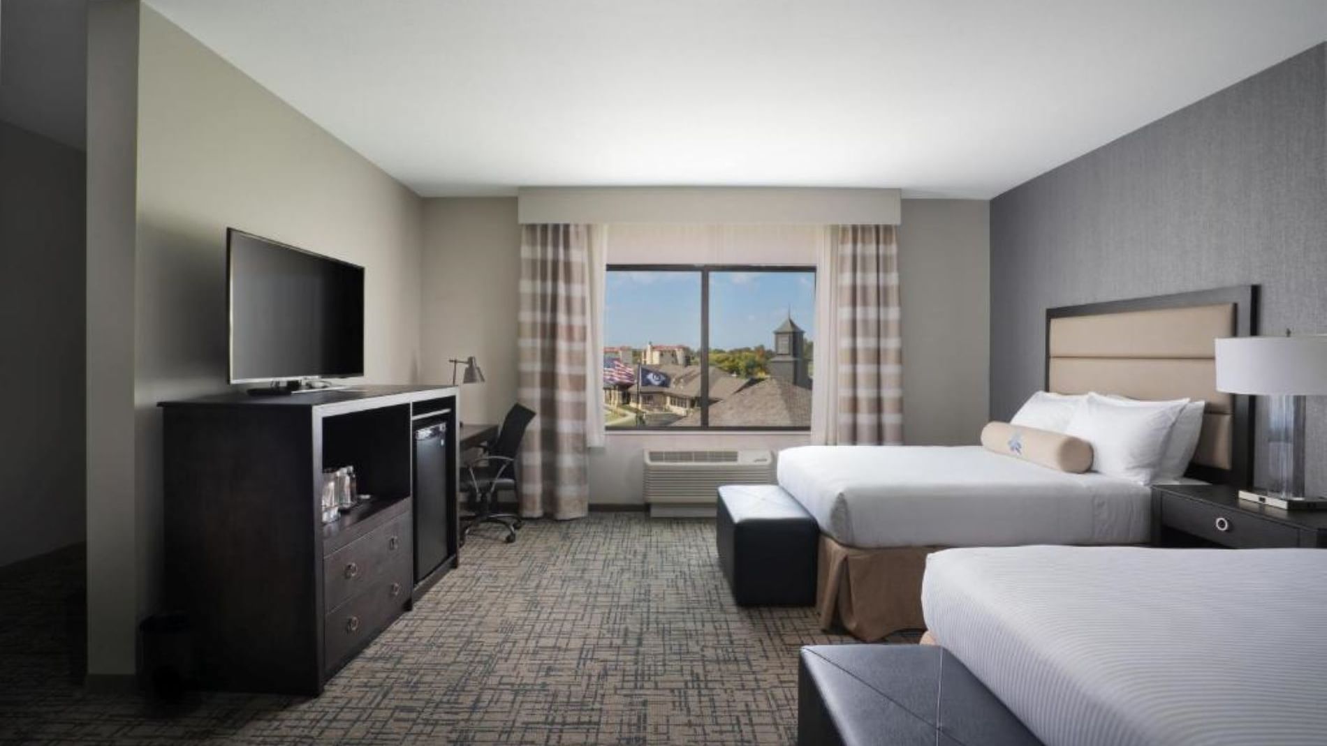 Accessible double queen room featuring two queen-sized beds and a work desk at Shangri-La Monkey Island