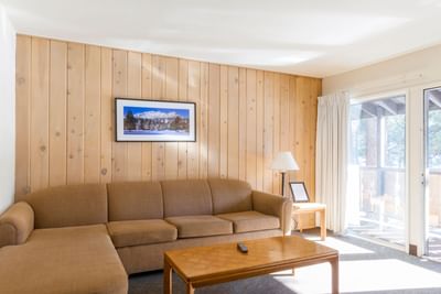 Room with sofa and door to balcony at Alpenhof Lodge