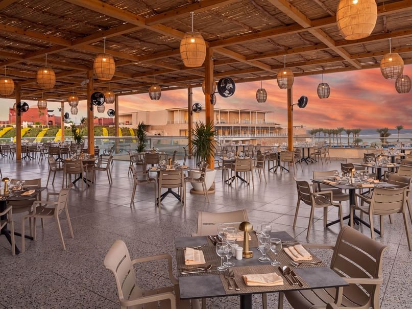 Open-air Rooftop Restaurant with woven pendant lights and sunset views at Pickalbatros Vita Resort - Portofino Marsa Alam