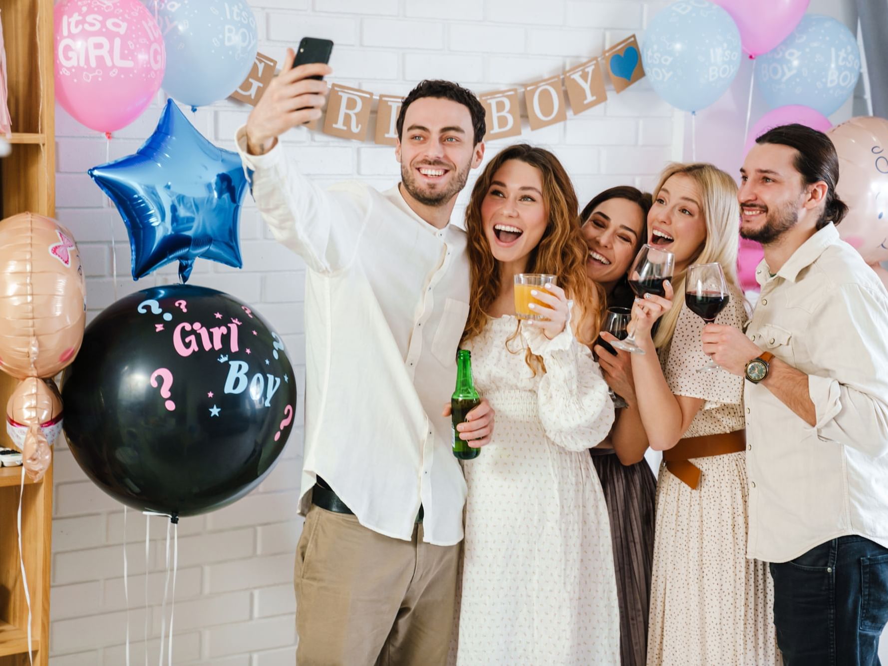 Group of friends celebrating a gender reveal