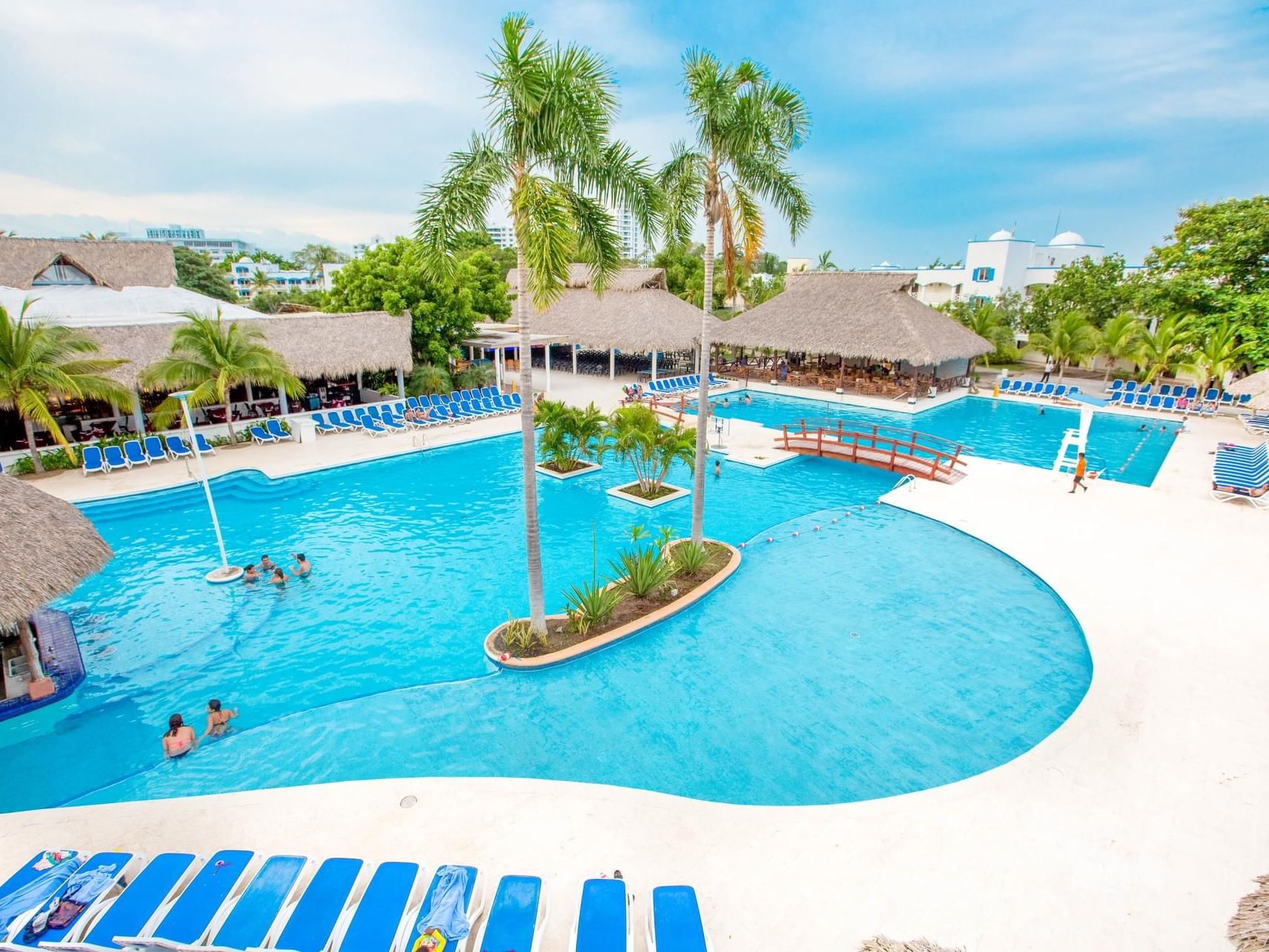 People lounging & playing in the Saltwater pool at Playa Blanca