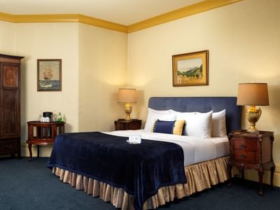 King-size bed with a headboard and nightstands in Pendray Room at Pendray Inn & Tea House
