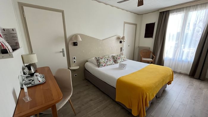 Bedroom interior in Hotel L'Iroko at The Originals Hotels