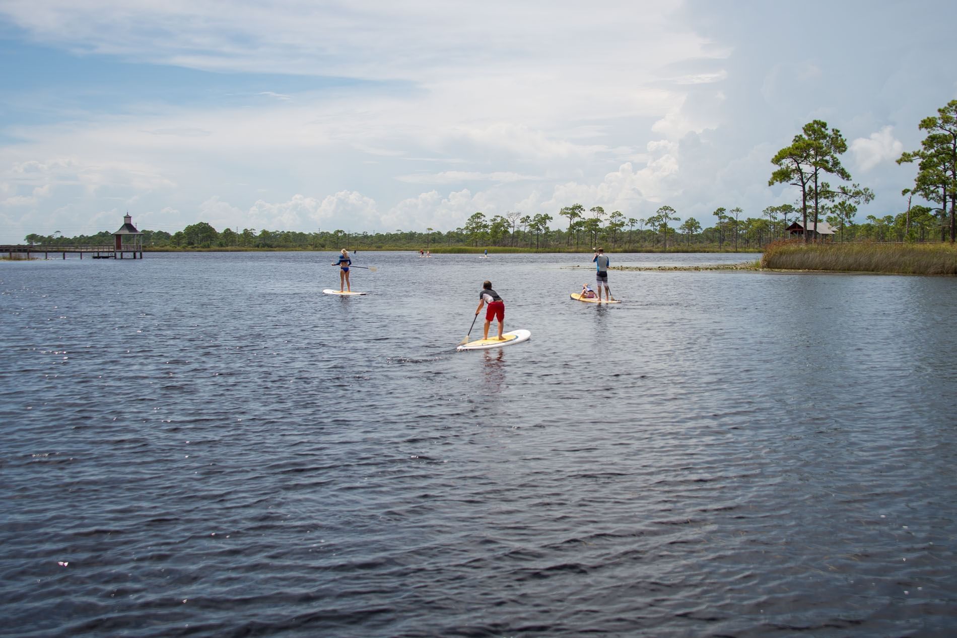 People with their small boats on the River near The Pearl Hotel