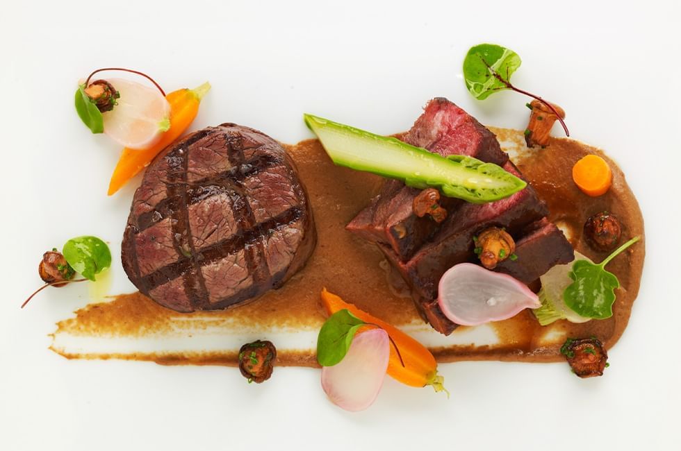 Top view of a garnished beef dish at Goodwood Park Hotel