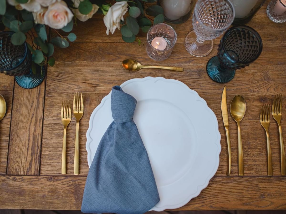 Plate setting on table at a wedding at the La Colección Resorts