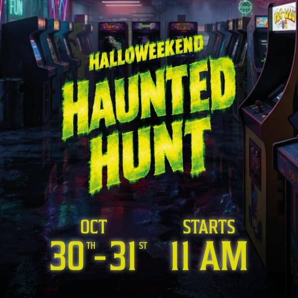 Vintage arcade game room with neon-lit Halloweekend Haunted Hunt event poster displaying October 30-31 dates and 11 AM start time.