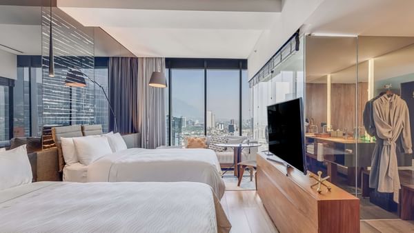 Modern interior with TV in Deluxe mountain view, 2 double room at FA Hotels & Resorts