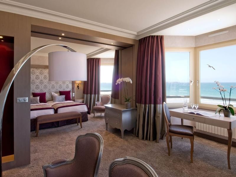 Interior of a Suite with carpeted floors & Sea view at Le Grand Hôtel des Thermes