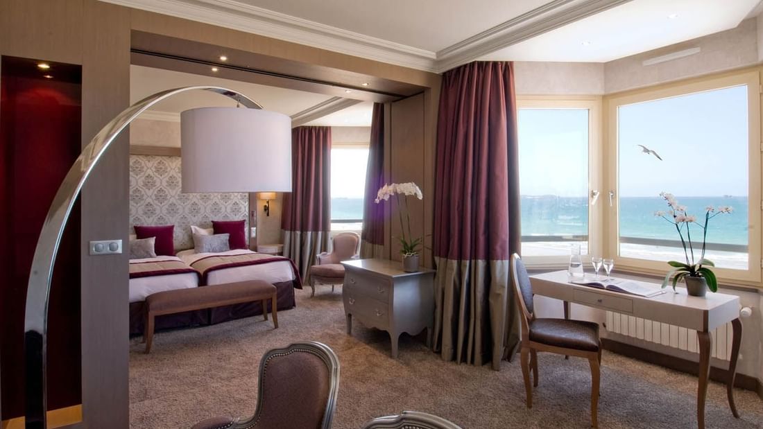 Interior of a Suite with carpeted floors & a Sea view at Le Grand Hôtel des Thermes