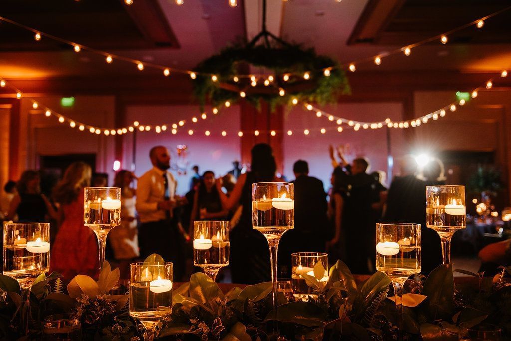 Decorated wedding reception with flickering candles & twinkling lights at Umstead Hotel and Spa