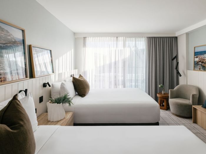 Village Terrace Twin at Elysium Manly with white linen beds by wooden side tables, best places to stay in Manly