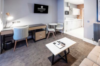 The living area and the pantry area in a room at the Sandman Sig