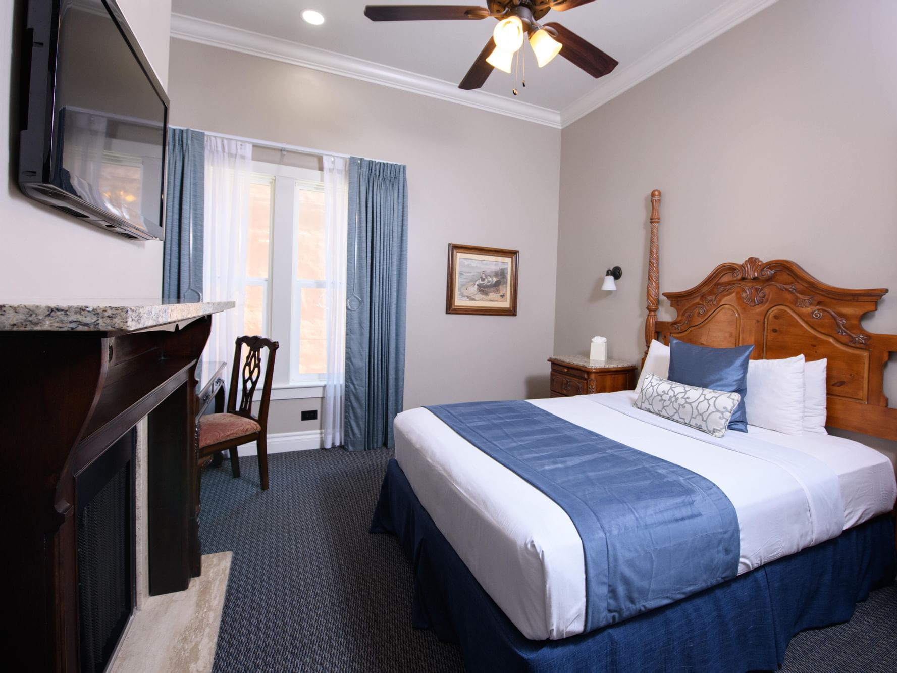 TV and work desk facing the bed in 1 Queen Accessible Room at Horton Grand Hotel