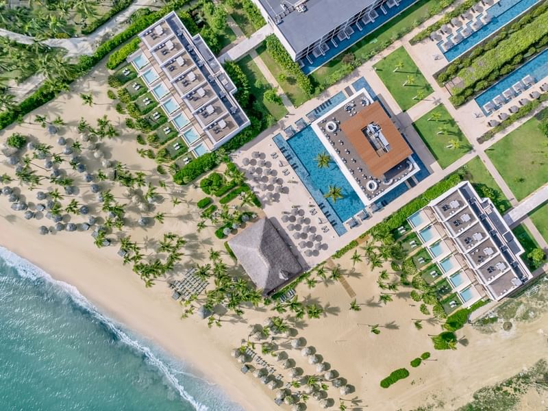 Aerial view of the hotel complex, pools & beach at Live Aqua Resorts and Residence Club