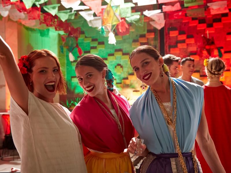 Three ladies smiling and posing for a photo at Fiesta Americana