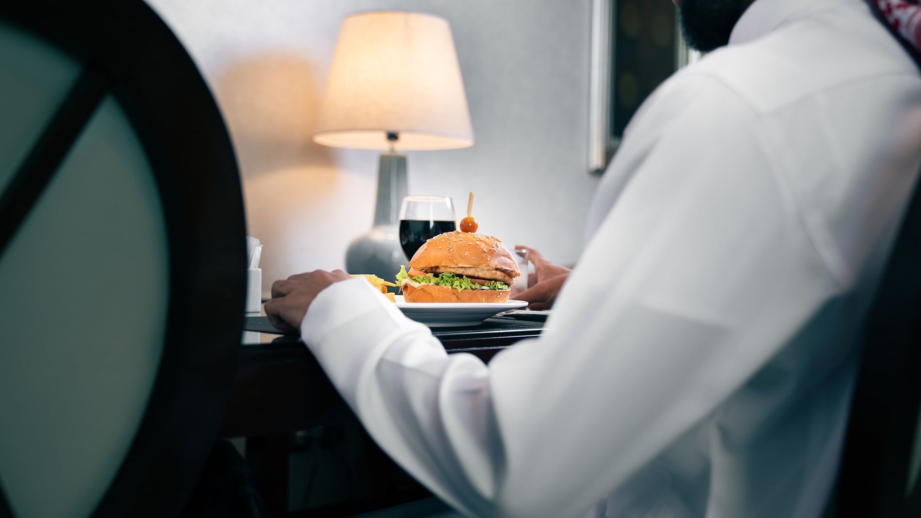 Man enjoying a meal at Saja by Warwick Makkah in Makkah.