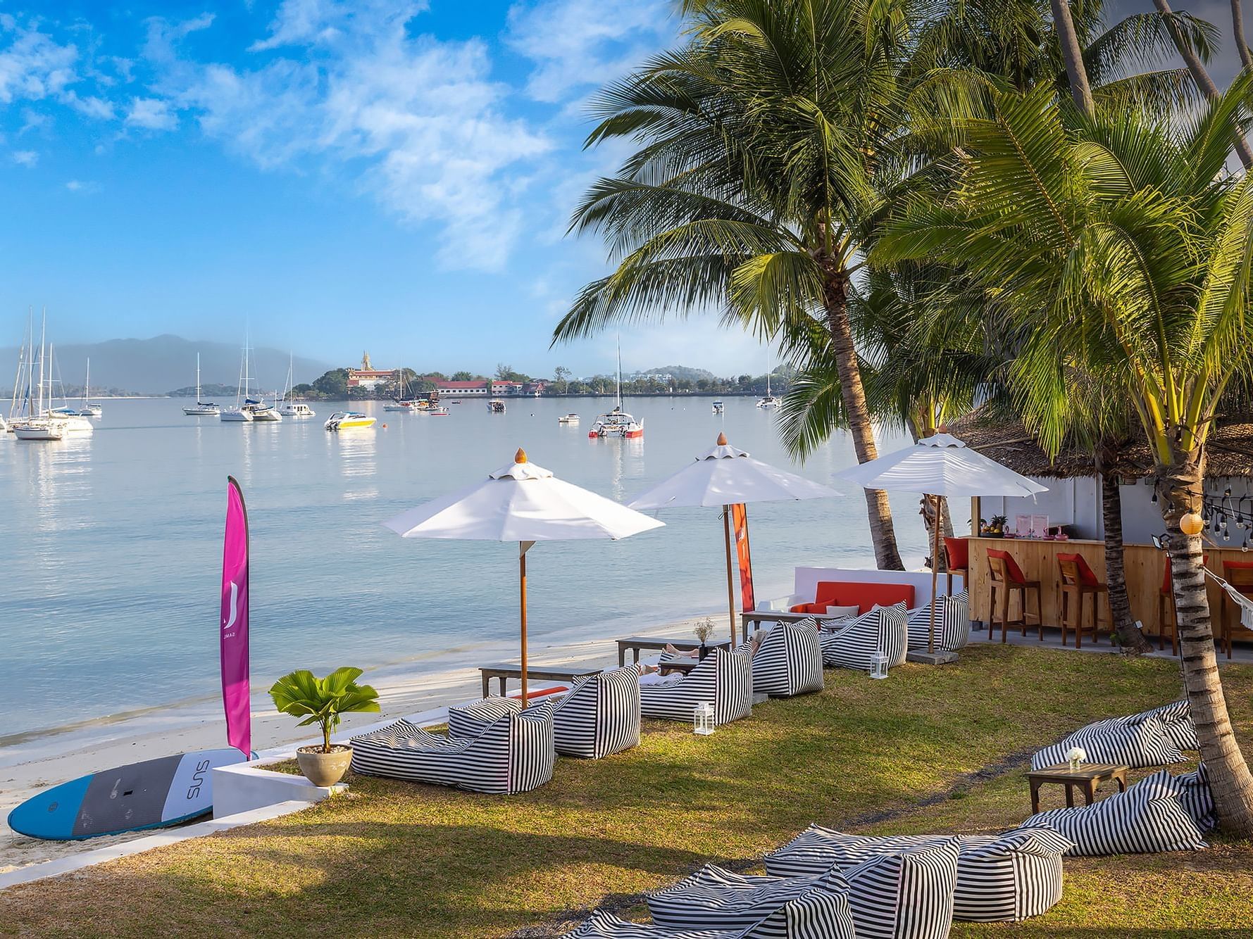 Sunbeds & canopies by the beach at U Hotels & Resorts