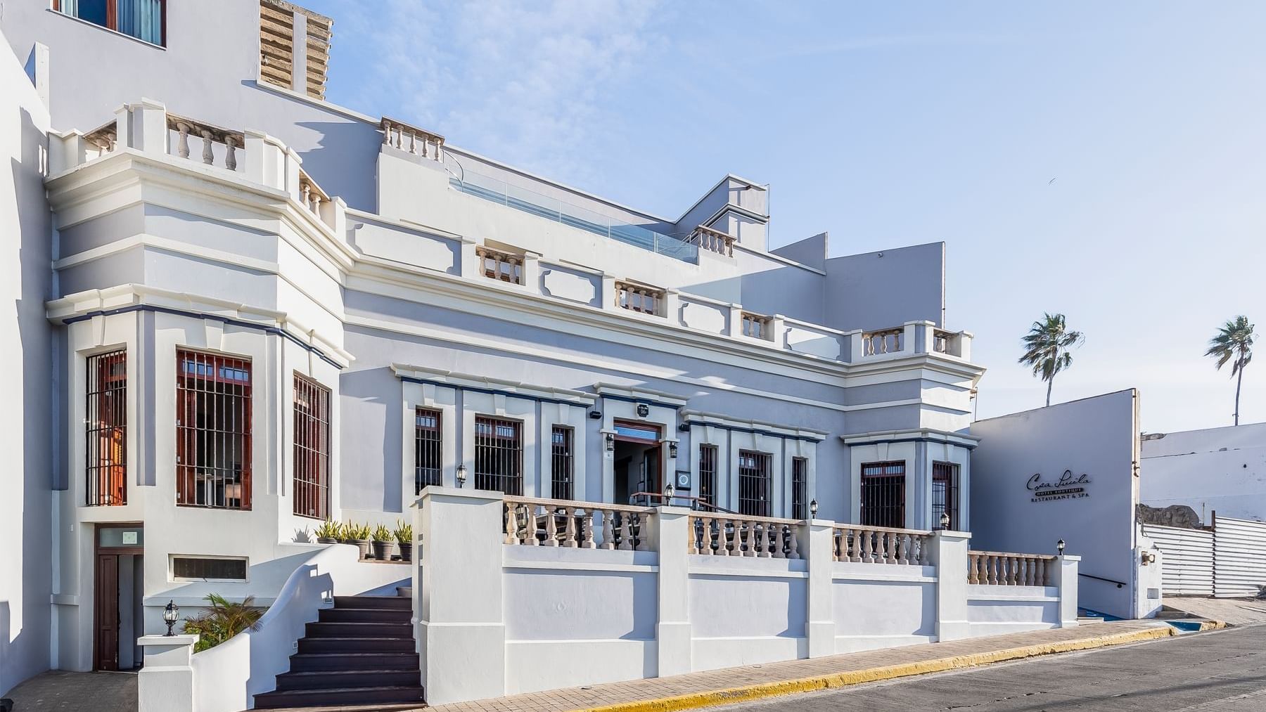 Exterior view of Curamoria Collection front entrance, and street-side presence