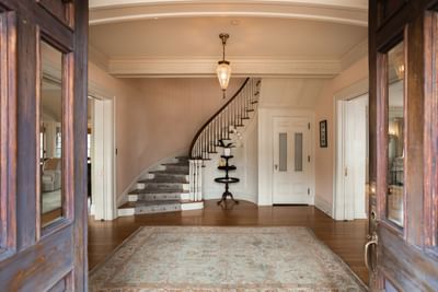 Entryway with staircase and wooden floors at Mt Ada, 4 star hotel Catalina Island