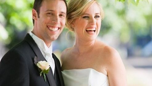Wedding couple smiling and poses for a photo at Pullman Sydney H