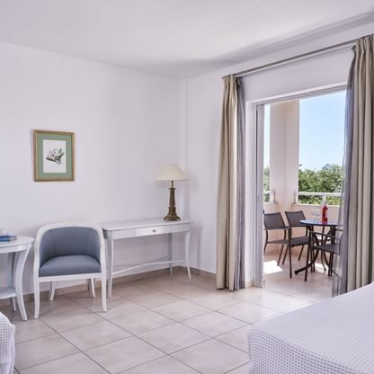 Bedroom & balcony in Standard Family Room at Sandy Beach Resort