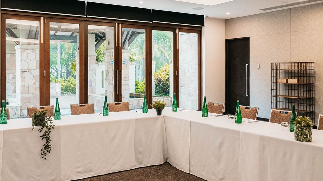 U-shaped table set-up with large window in Temple Room at Pullman Port Douglas