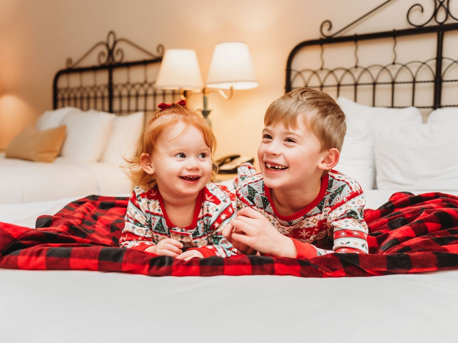 Family enjoying a cozy room at the Oregon Garden Resort during the annual Silverton Christmas Market