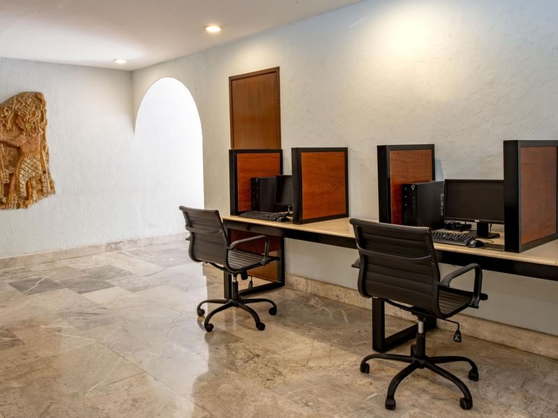 Desk & computer in a Business Center at Gamma Hotels