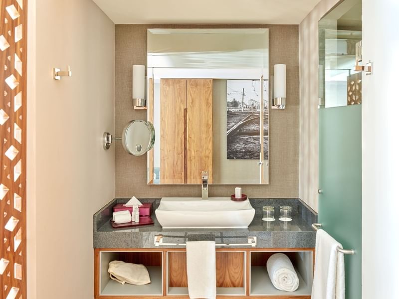 Bathroom vanity area in Deluxe room at FA Hotels & Resorts