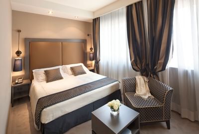 King Bed & furniture in Double Superior at Hotel Mozart Milan