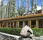 Exterior View of Hunza Serena Inn with building & trees