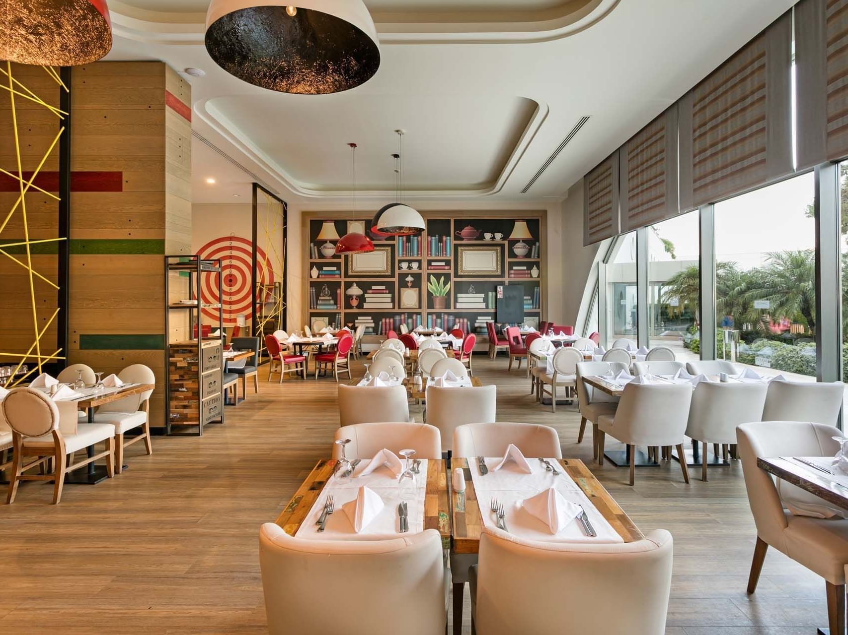 Dining tables and chairs arranged elegantly in Parkfora Main Restaurant at Titanic Deluxe Lara