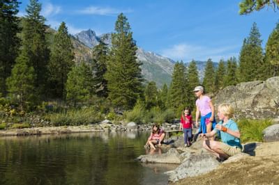 Guests spending time in the creek at Sleeping Lady Mountain