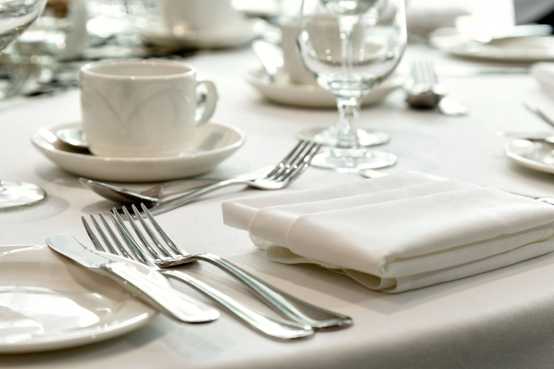 Silverware and drinkware on table
