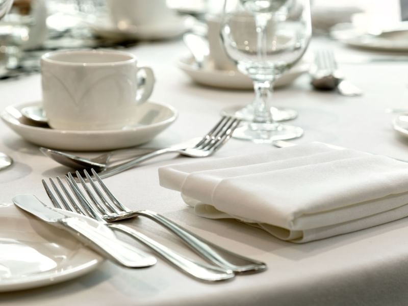 Drinkware and silverware at table for event