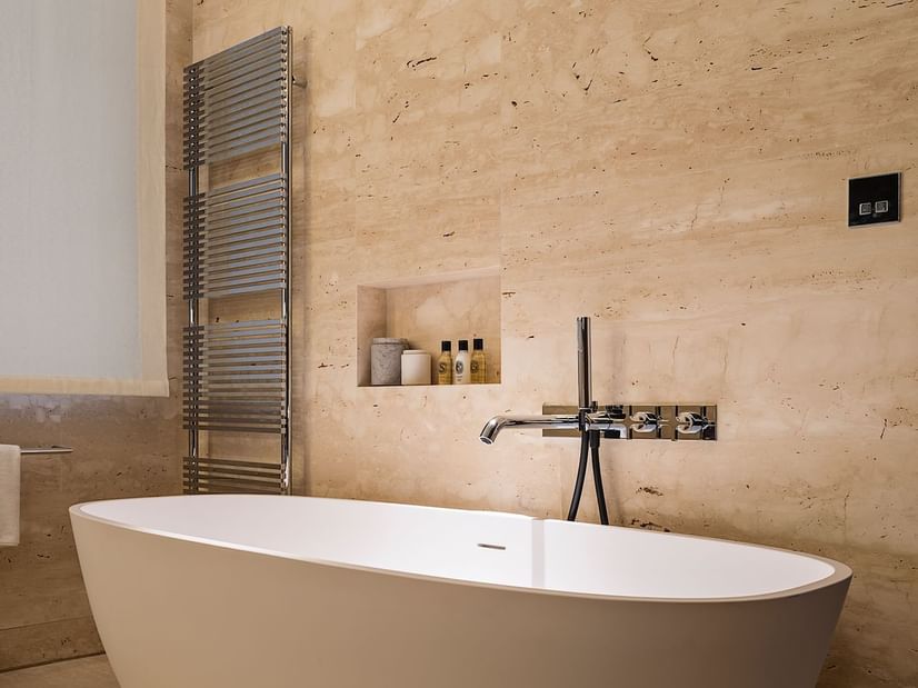 Bathtub & amenities in Deluxe Suite 7 at Fendi Private Suites