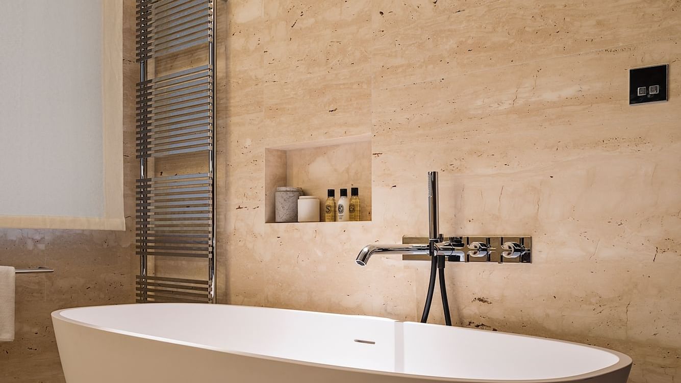 Bathtub & amenities in Deluxe Suite 7 at Fendi Private Suites