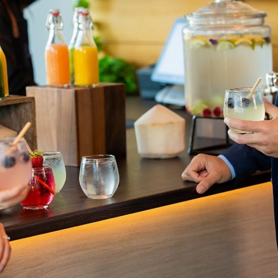 refreshment station at magenta shores with juices and cocktails