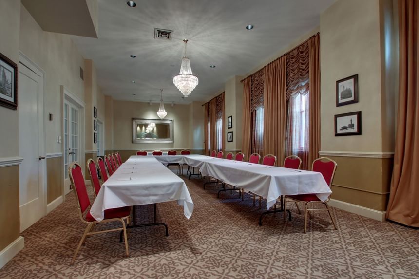 U-shaped table setup with carpeted floors in The Juneau Room at Knickerbocker On The Lake, featuring Milwaukee event venues