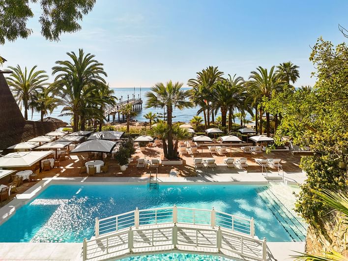 Wide shot of the Outdoor pool by the beach at Marbella Club
