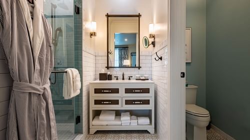 Bathroom vanity & shower area in Junior Golf Suite at Camp Creek Inn