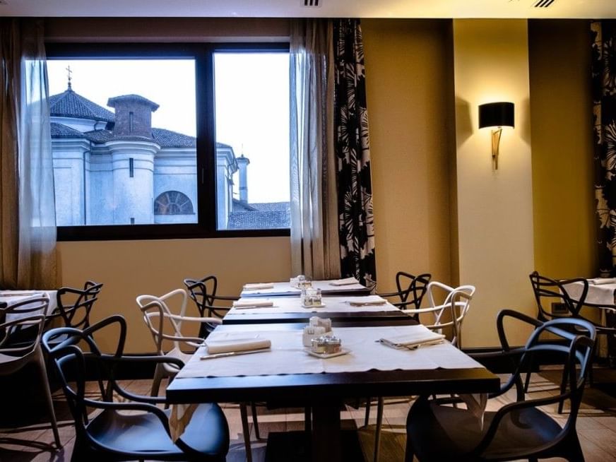 Dining tables arranged in Up Restaurant at Extro Hotels