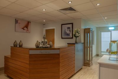 Interior view of a Spa lobby area with reception desk at Orsett Hall Hotel
