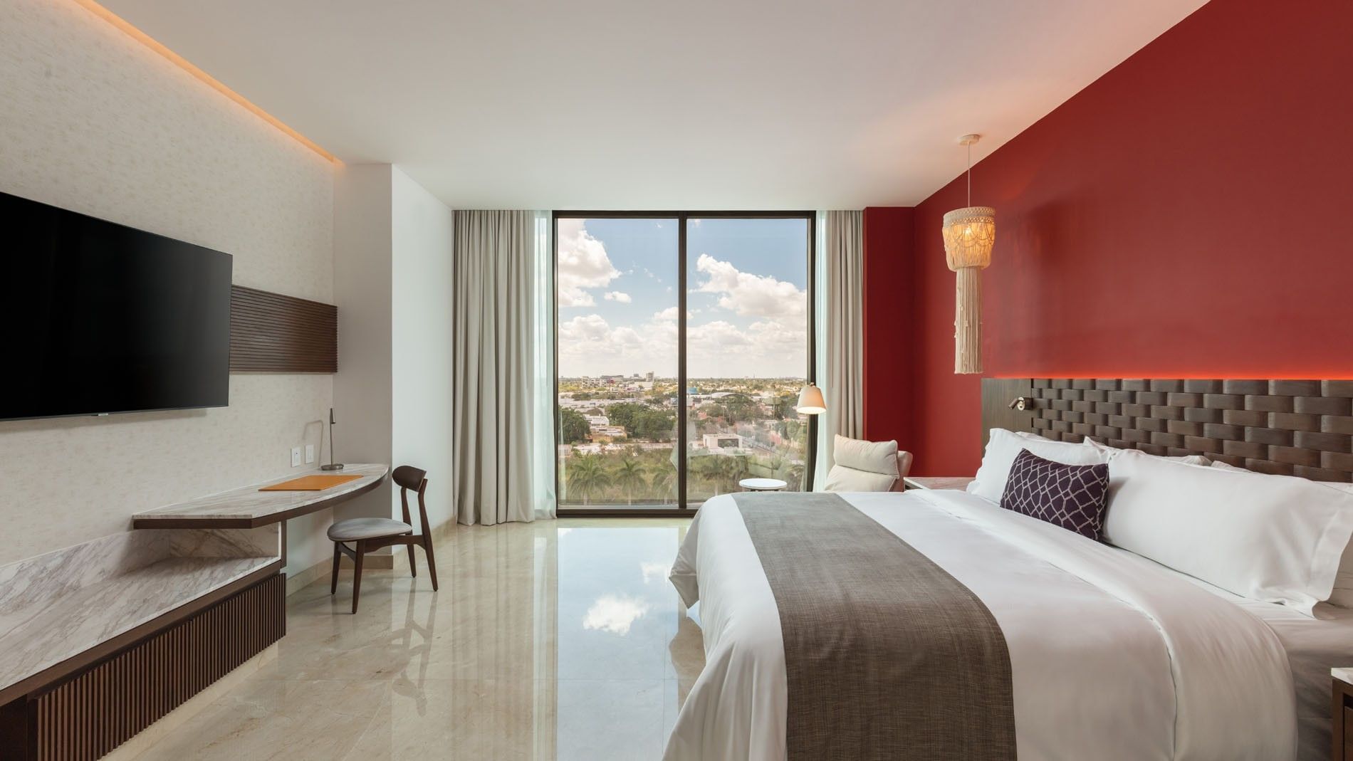 King Deluxe Superior room with marble floors, a workspace, and vast windows overlooking the city at Camino Real Merida
