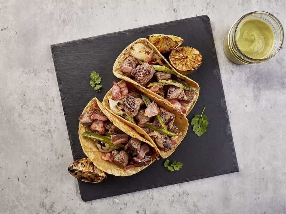 Three chicken tacos with a milkshake at One Hotels