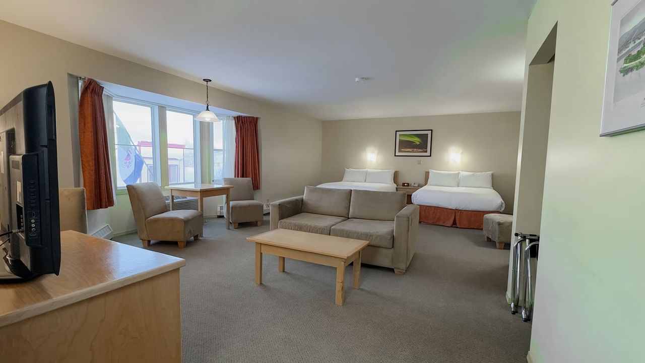 hotel room sitting area with sofa bed and coffee table